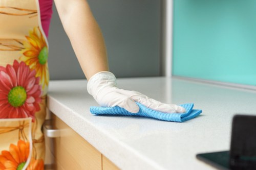 Staff separating recyclable packaging and cleaning materials