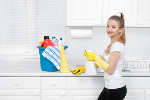 Cleaning technician preparing carpet cleaning equipment safely