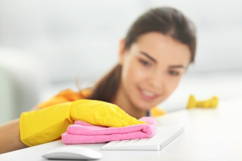 Cleaner using PPE during a carpet cleaning job